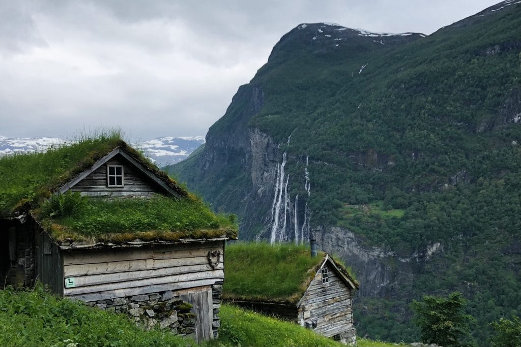 Geiranger’s Skageflå farm overlooking the waterfall, featured among overrated places in Norway with better and quieter alternatives.
