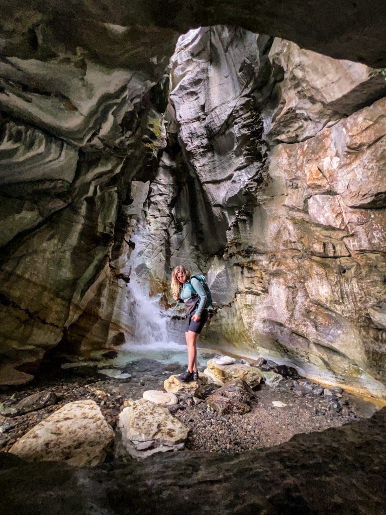 Inside Trollkirka cave with its hidden waterfall, shown as an alternative to overrated places in Norway.