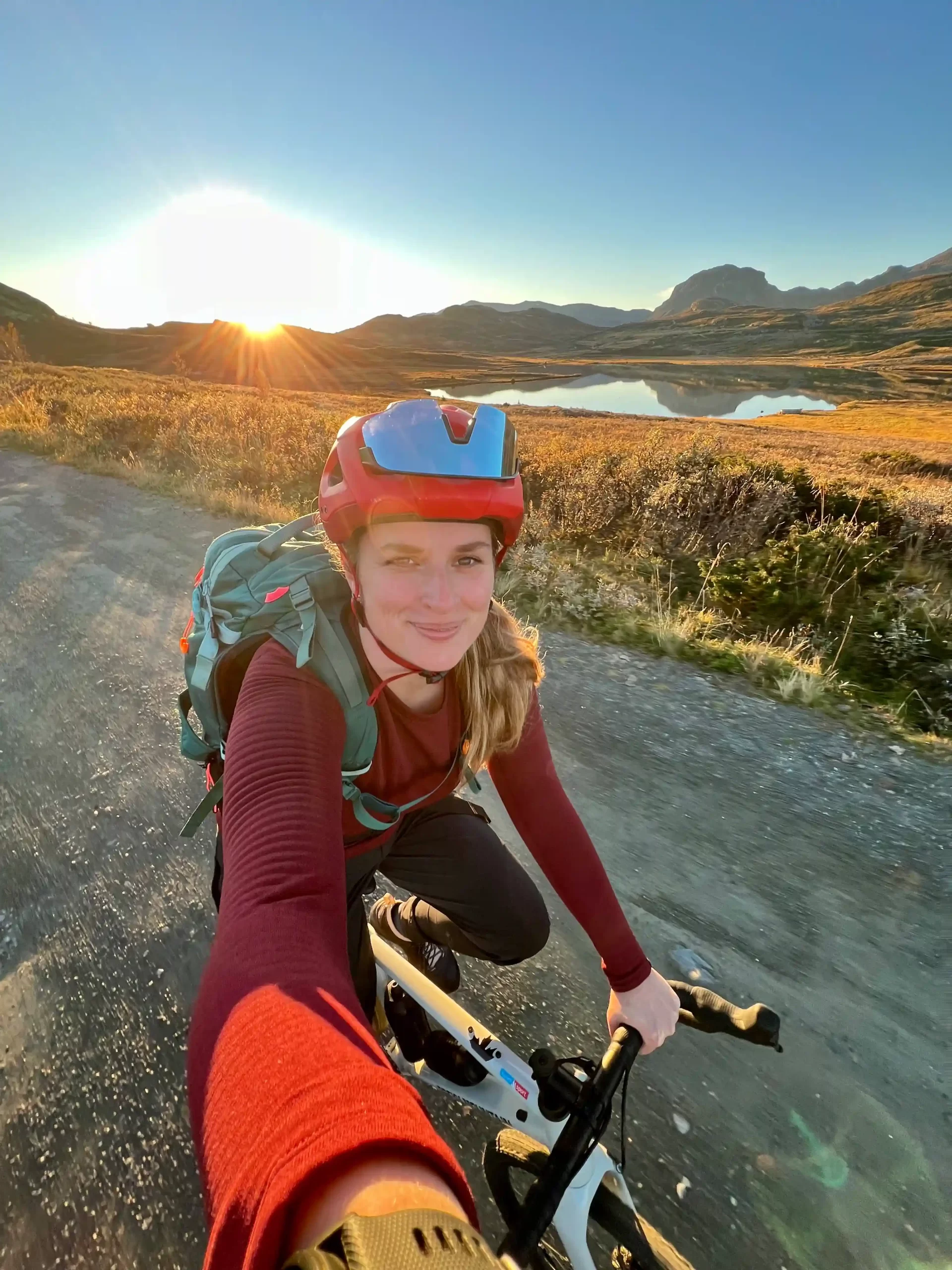 About Jana cycling through an open mountain landscape in Norway