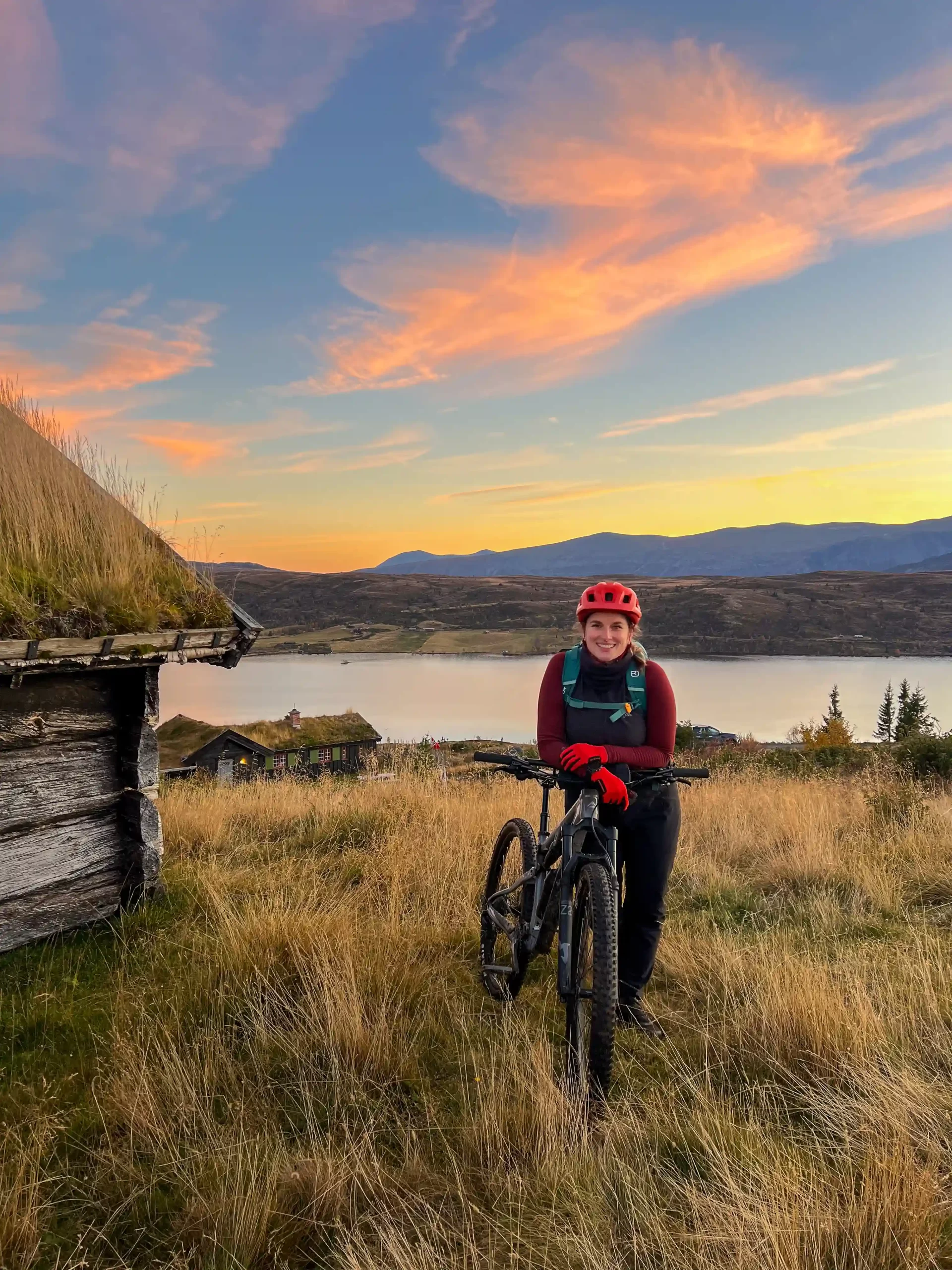 Outdoor creator with mountain bike in Norway at sunset