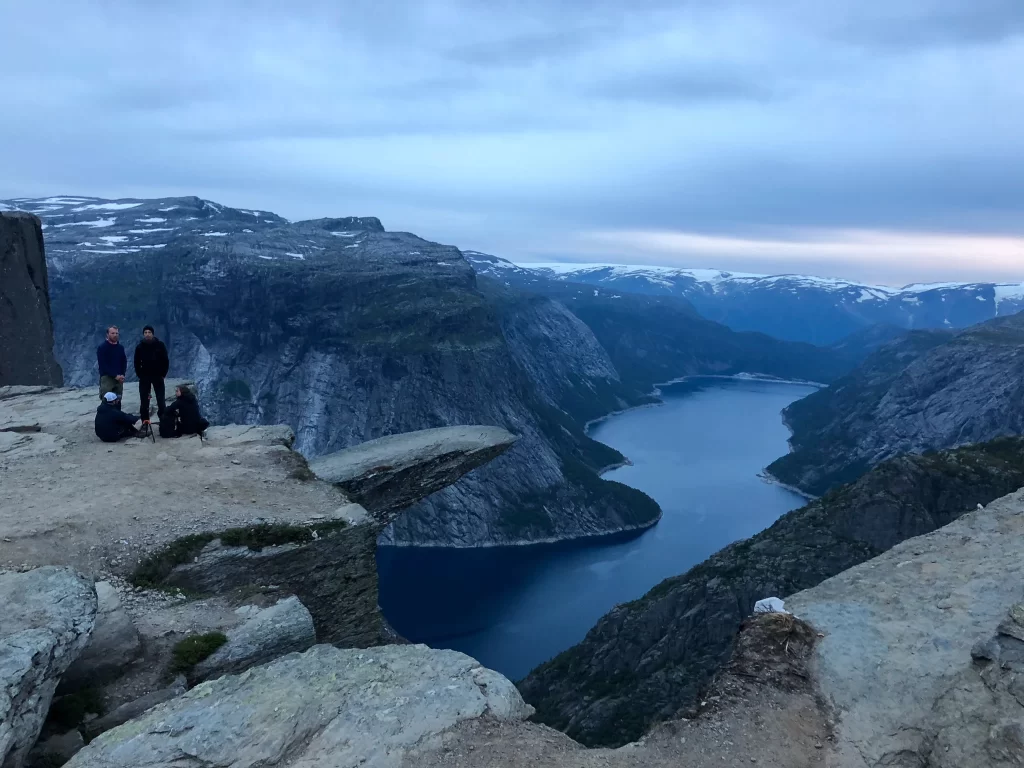 Evening light at Trolltunga rock above Ringedalsvatnet during a two-day Trolltunga hike in July.